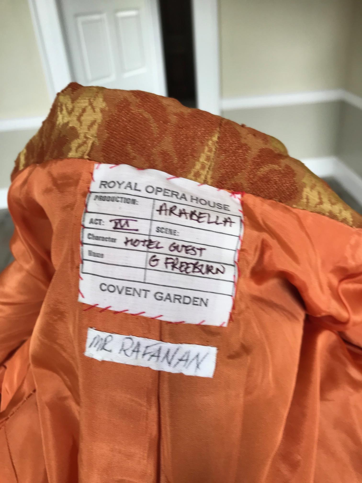 A man's 19th century smoking jacket, mustard velvet, with brocade lapels and cuffs. Ex Royal Opera House 'Arabella'